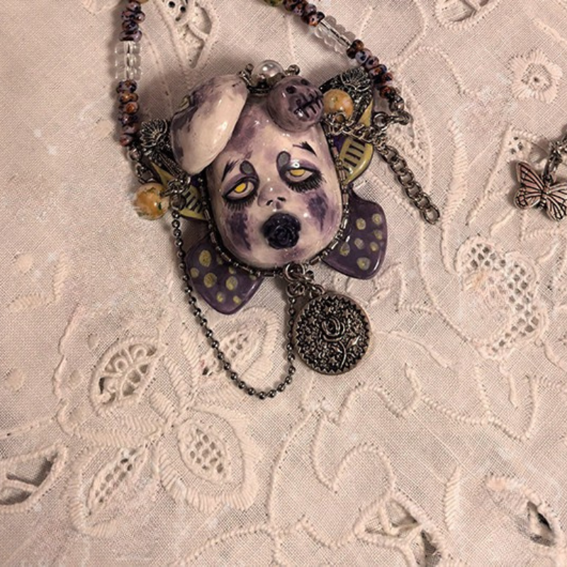 Muted Purple Sorrowful Doll Face Rose Coin Necklace